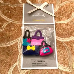 New in package set of 4 Hallmark handbag erasers.